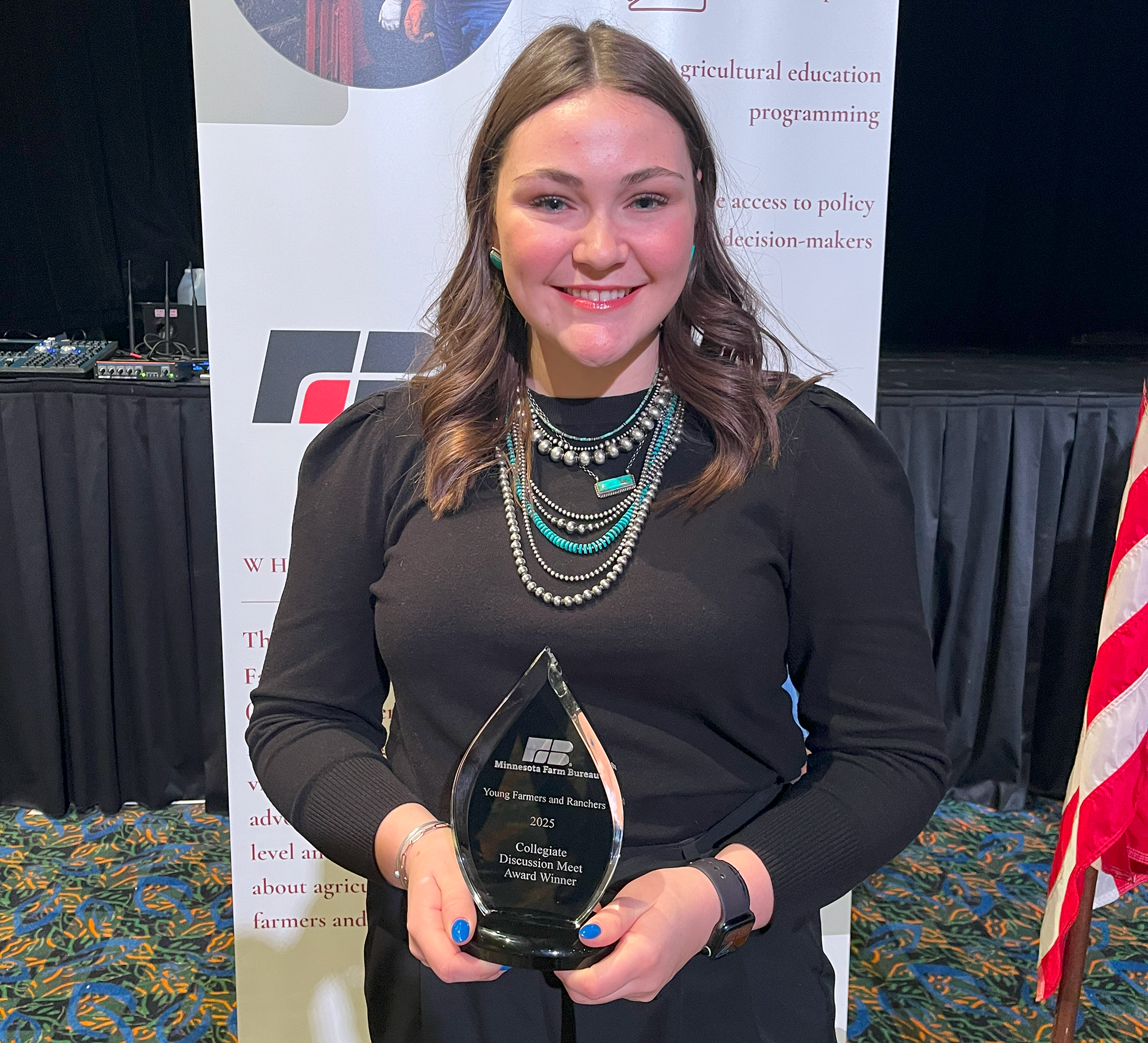 Katie Radman holding an award