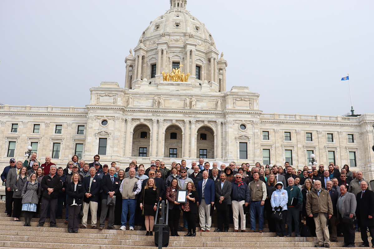 large group of Farm Bureau members standing in front of Minnesota State Capitol